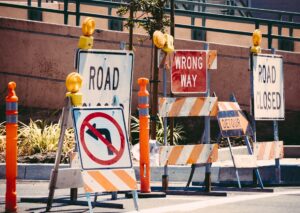 A photograph of road construction and road closed signs.